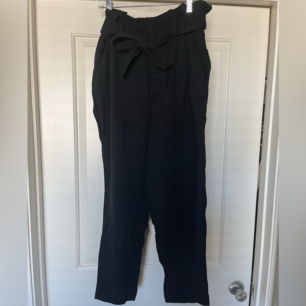 Black business casual pants with ruffle and tie at waist. Size Medium.